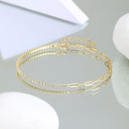 This image features a sophisticated Gold-Plated Sterling Silver Zircon Bracelet. The bracelet showcases a sleek paperclip chain design, enhanced by a row of shimmering zircon stones set along its length.