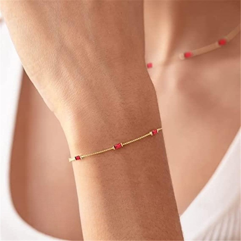 Silver and Gold-Plated Bracelet with Red Zircon Stones 