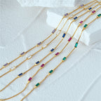 Silver and Gold-Plated Bracelet with Zircon Stones on hand