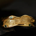 Gold-Plated Textured Wave Ring with Green Gemstones